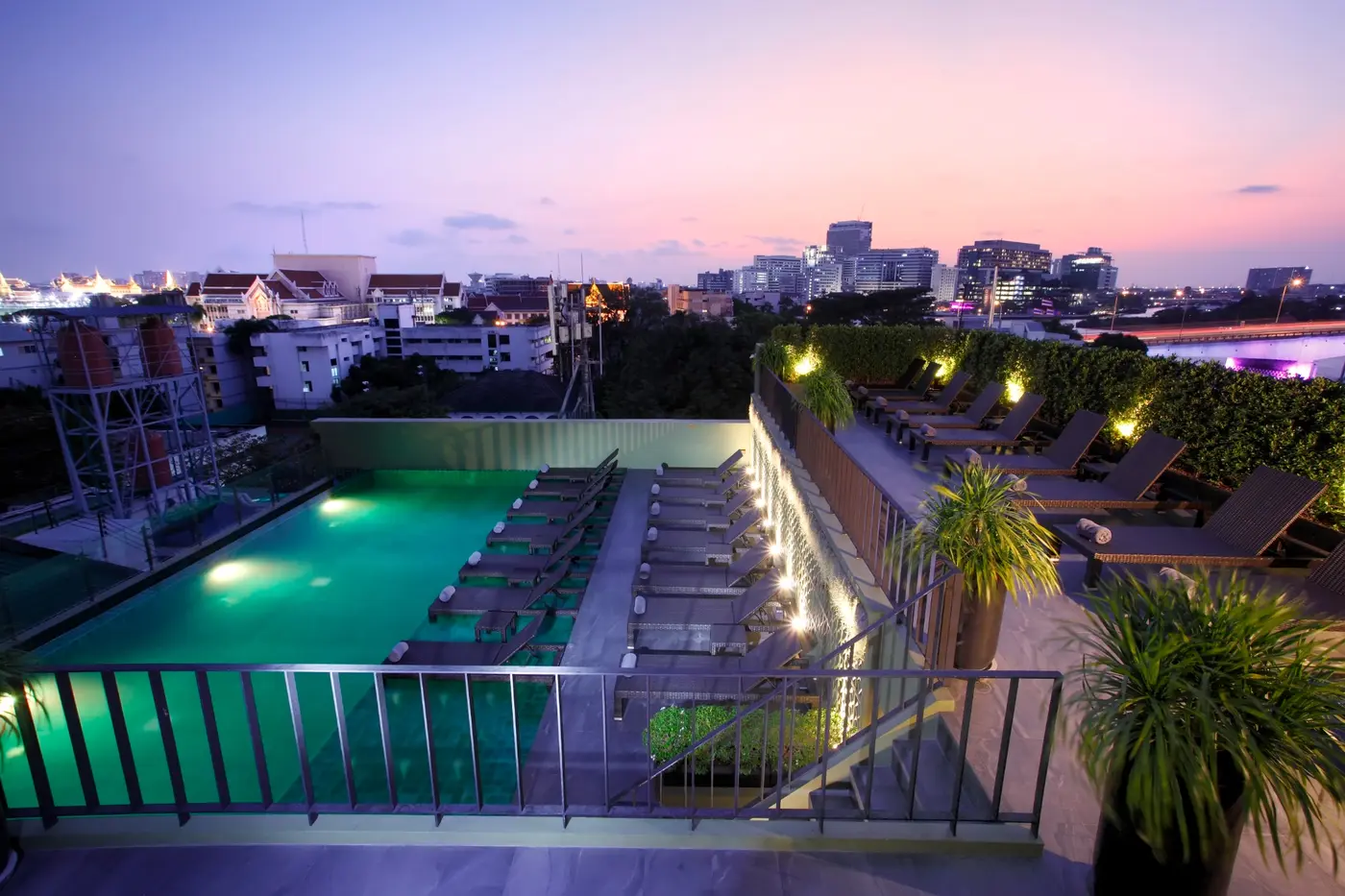 Rooftop pool glowing at sunset